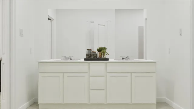 a bathroom with a sink and vanity