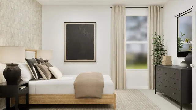 a bedroom with a bed and a dresser