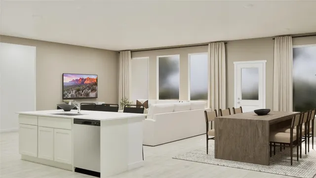 a room with a table chairs and a couch