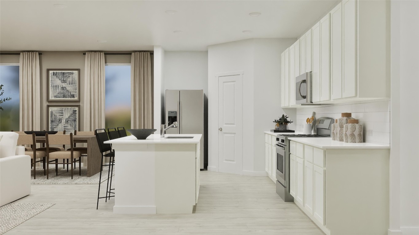 2935 Blue Rdg Lane Temple, TX 76501 - Photo 7 of 29 a kitchen with stainless steel appliances kitchen island granite countertop a refrigerator and a stove top oven