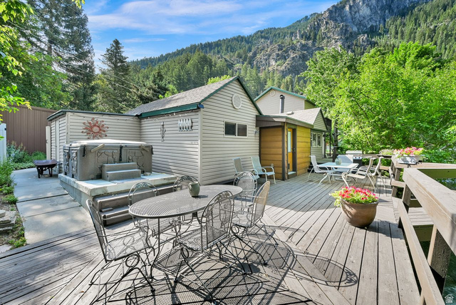 655 Ogden Canyon Road Ogden, UT 84401 - Photo 3 of 50 Expansive exterior wood deck with a built-in spa on a concrete pad