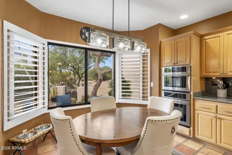 a kitchen with stainless steel appliances granite countertop a sink and cabinets