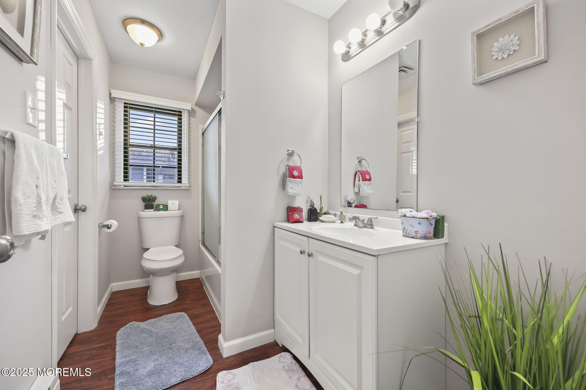 49 Markham Road Brick, NJ 08724 - Photo 13 of 21 a bathroom with a sink a toilet and a large mirror