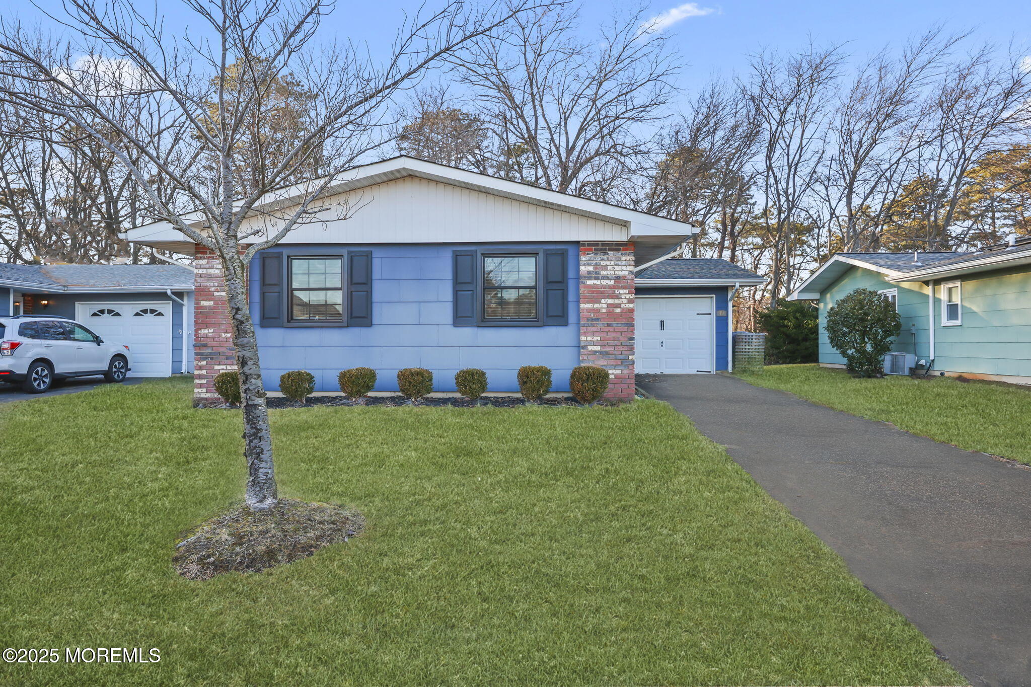 49 Markham Road Brick, NJ 08724 - Photo 14 of 21 a front view of a house with a yard and garage
