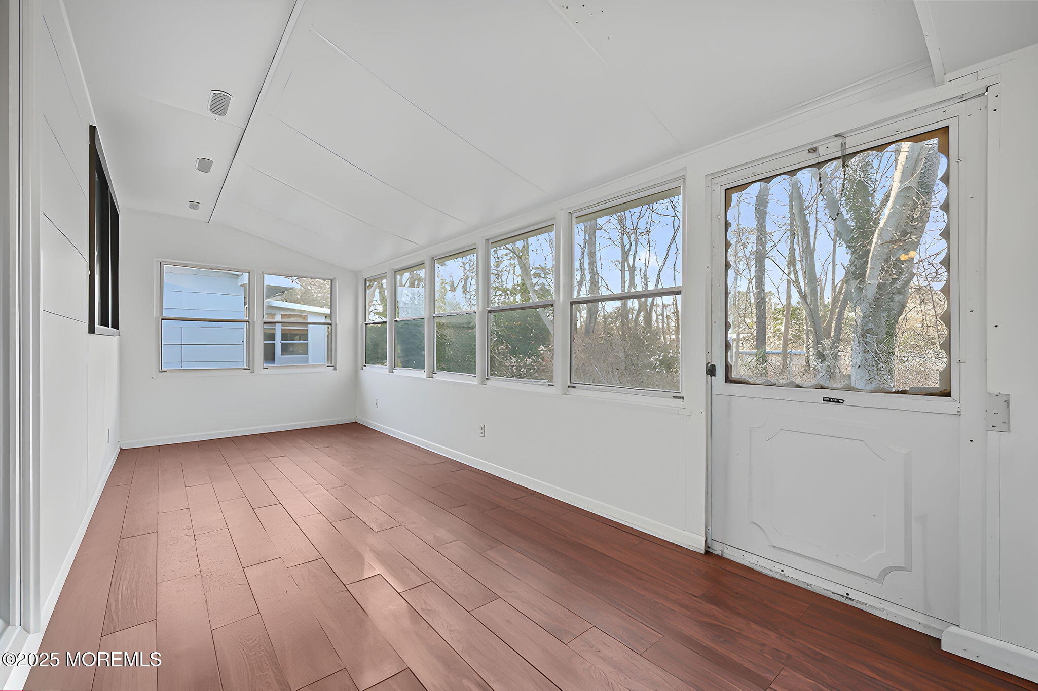 49 Markham Road Brick, NJ 08724 - Photo 14 of 21 a view of an empty room with wooden floor and a window