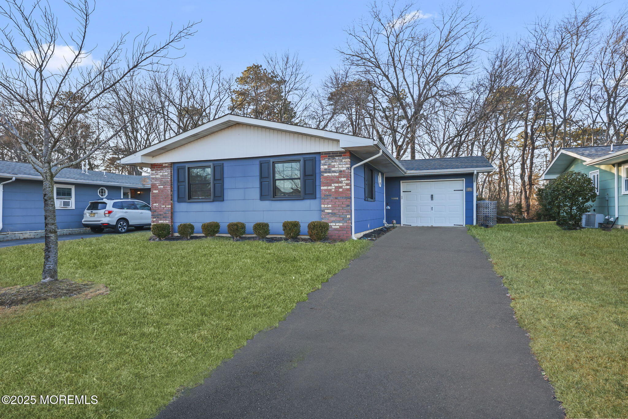 49 Markham Road Brick, NJ 08724 - Photo 17 of 21 a front view of house with yard and green space