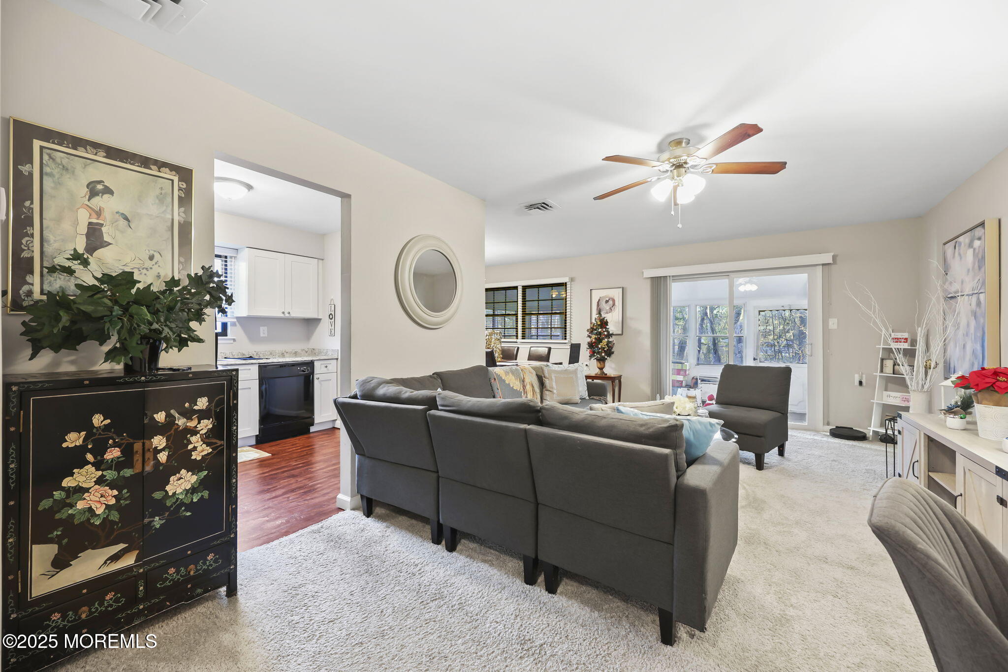 49 Markham Road Brick, NJ 08724 - Photo 18 of 21 a living room with furniture a fireplace and a flat screen tv