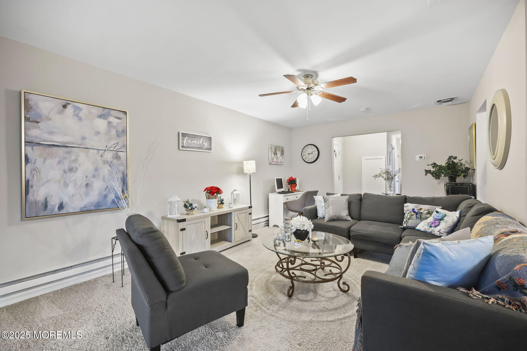 49 Markham Road Brick, NJ 08724 - Photo 2 of 21 a living room with furniture a couch and a ceiling fan