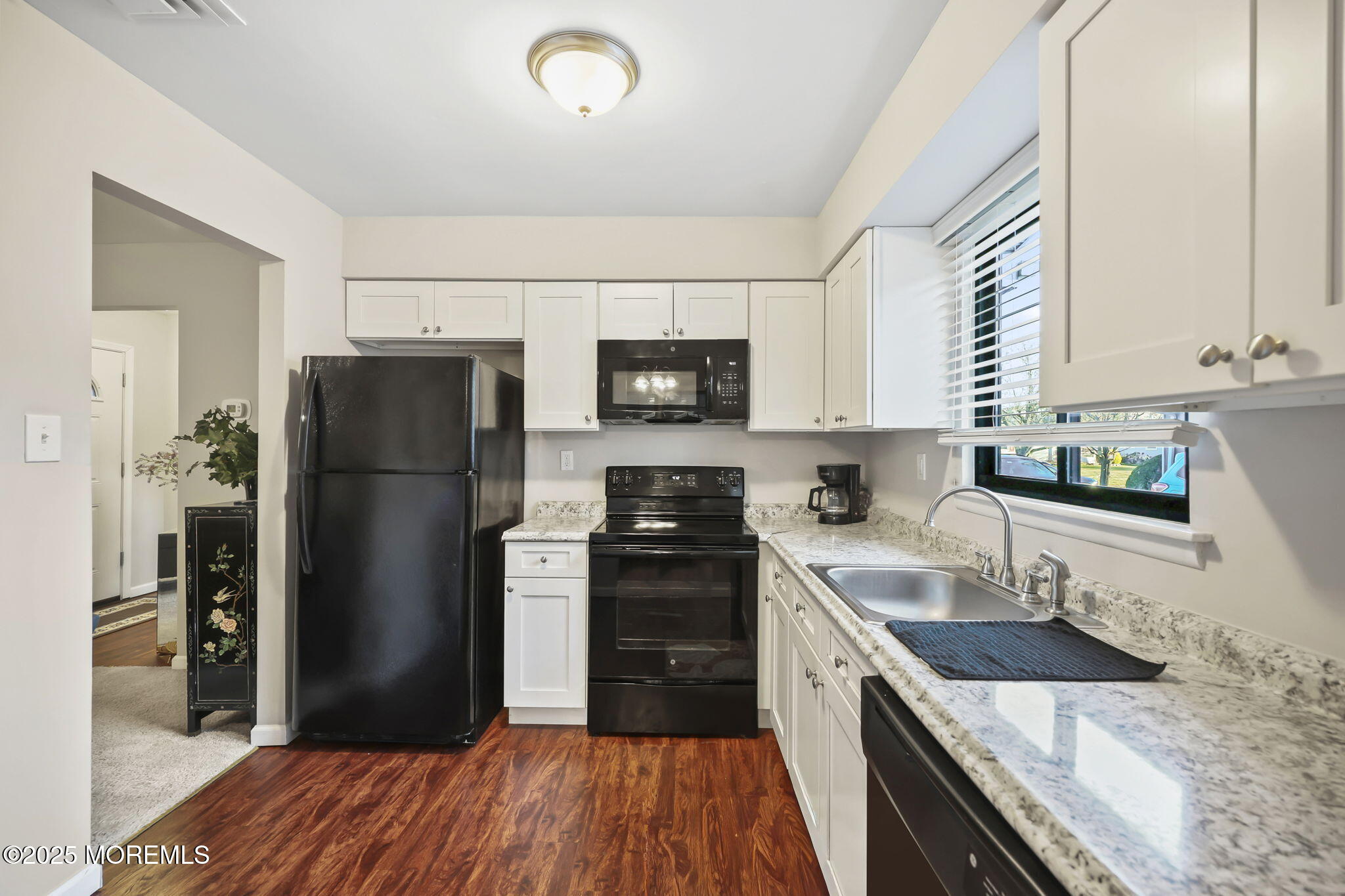 49 Markham Road Brick, NJ 08724 - Photo 4 of 21 a kitchen with granite countertop a refrigerator stove and sink