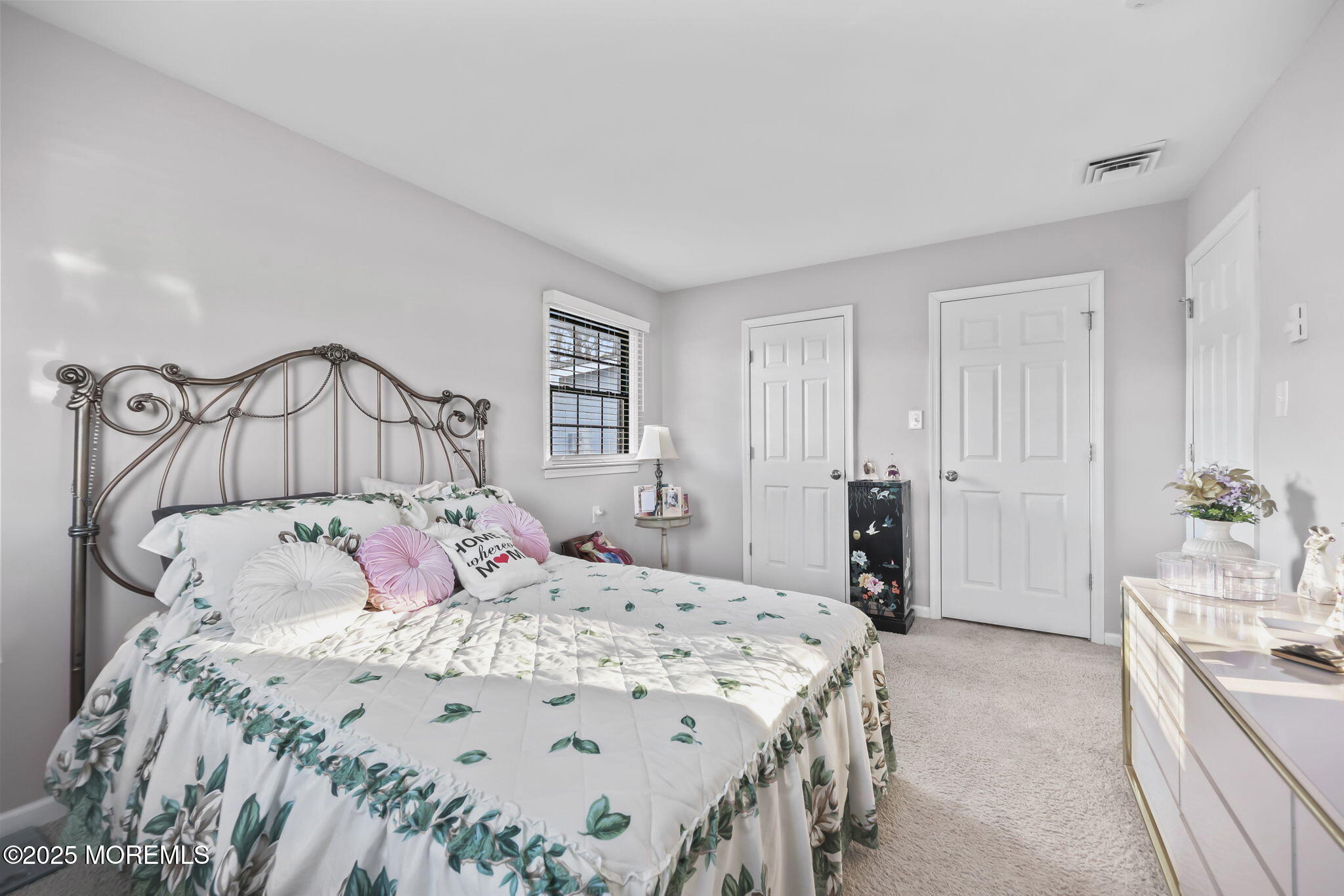 49 Markham Road Brick, NJ 08724 - Photo 10 of 21 a bedroom with a large bed and a chandelier