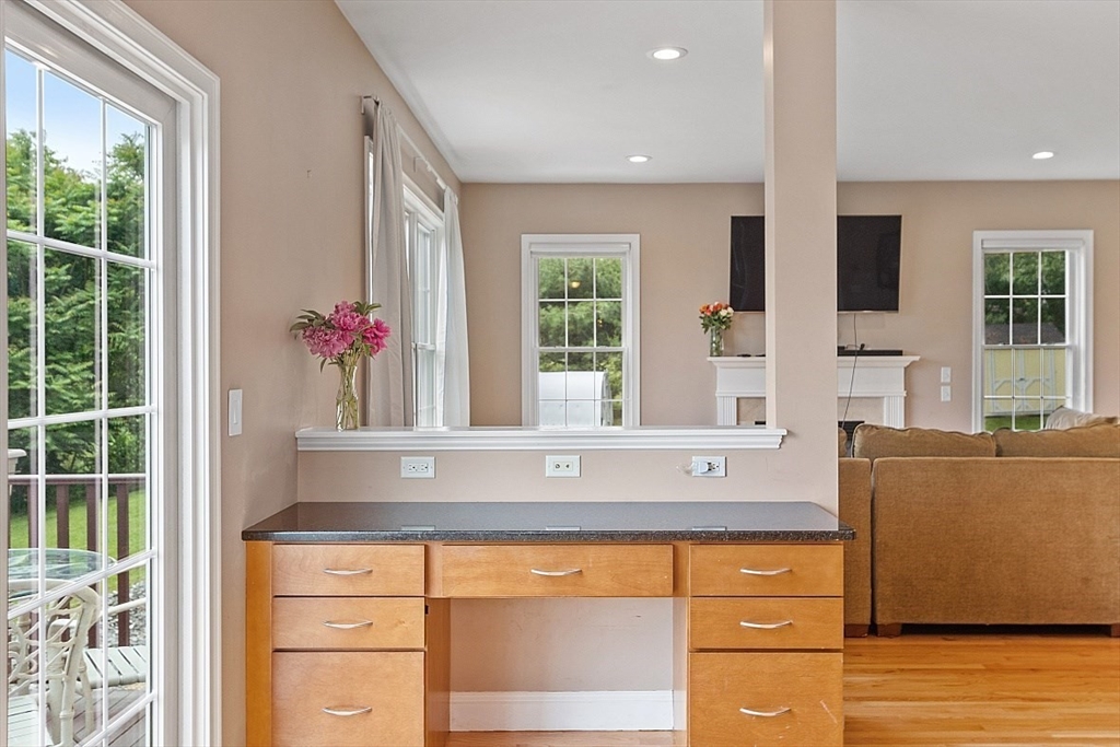 204 Littleton County Road Harvard, MA 01451 - Photo 12 of 42 a living room with stainless steel appliances granite countertop furniture and a potted plant