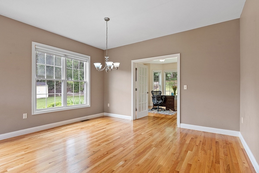 204 Littleton County Road Harvard, MA 01451 - Photo 15 of 42 a view of a room with wooden floor fireplace and a window