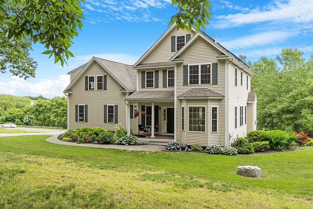 204 Littleton County Road Harvard, MA 01451 - Photo 2 of 42 a front view of a house with a yard