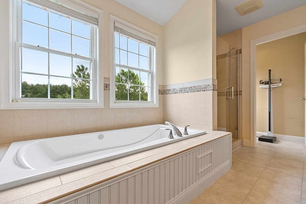 204 Littleton County Road Harvard, MA 01451 - Photo 22 of 42 a bathroom with a bathtub and a sink