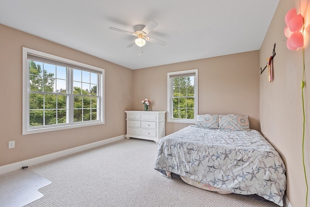 204 Littleton County Road Harvard, MA 01451 - Photo 23 of 42 a bedroom with a bed and a window