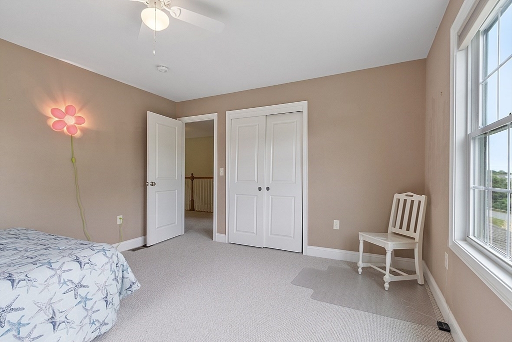 204 Littleton County Road Harvard, MA 01451 - Photo 24 of 42 a bedroom with a bed and a window