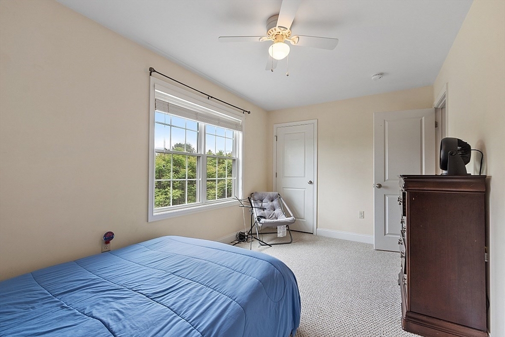 204 Littleton County Road Harvard, MA 01451 - Photo 26 of 42 a bed room with a bed and a window