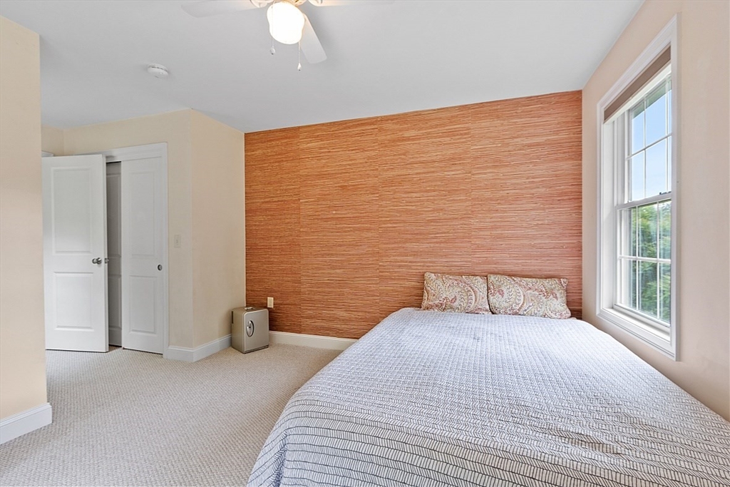 204 Littleton County Road Harvard, MA 01451 - Photo 28 of 42 a bedroom with a bed and a window