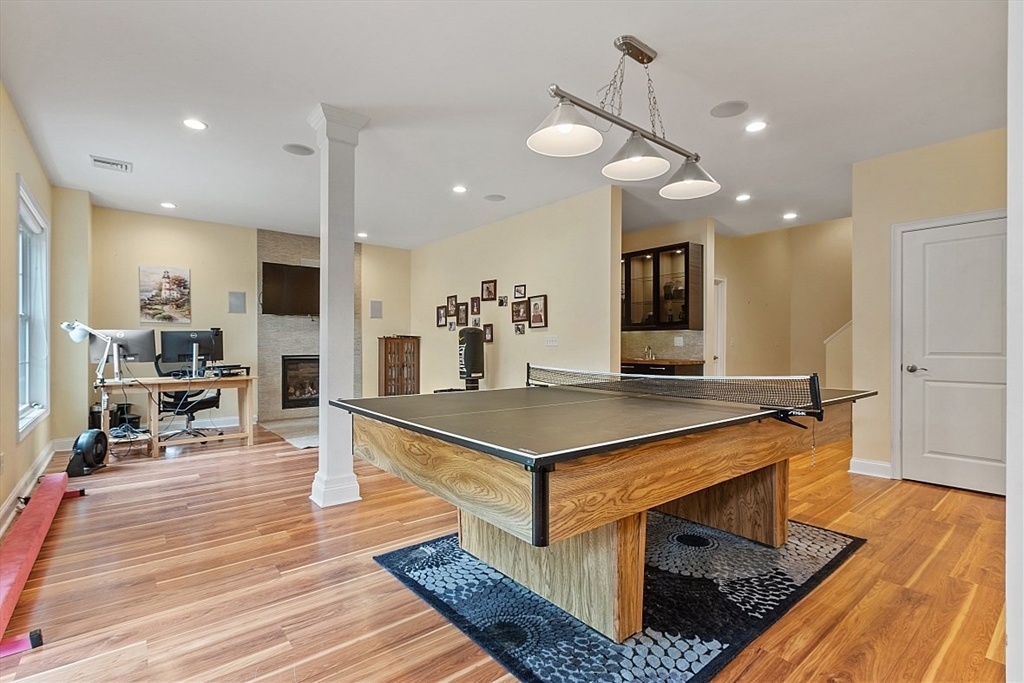 204 Littleton County Road Harvard, MA 01451 - Photo 29 of 42 a kitchen with stainless steel appliances granite countertop a stove refrigerator and cabinets