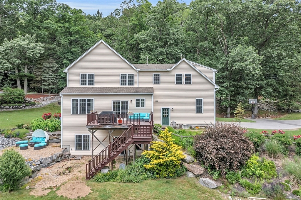 204 Littleton County Road Harvard, MA 01451 - Photo 37 of 42 a view of house with a yard and sitting area