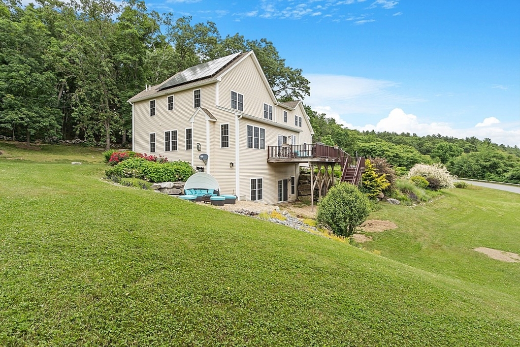 204 Littleton County Road Harvard, MA 01451 - Photo 4 of 42 a view of a house with a yard