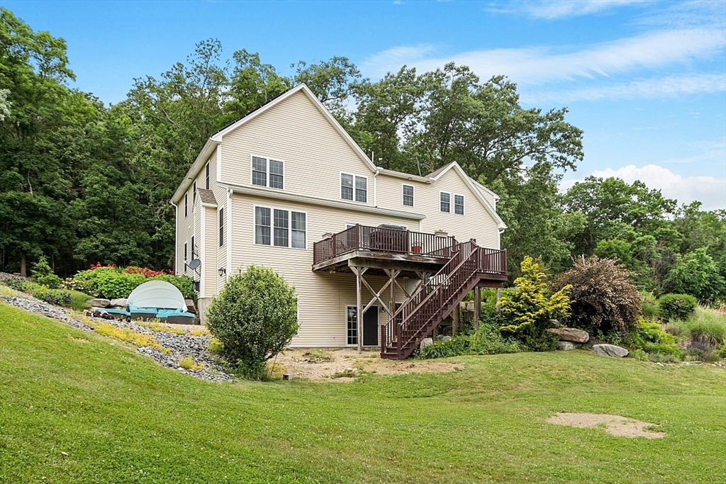 204 Littleton County Road Harvard, MA 01451 - Photo 5 of 42 a view of a house with a yard