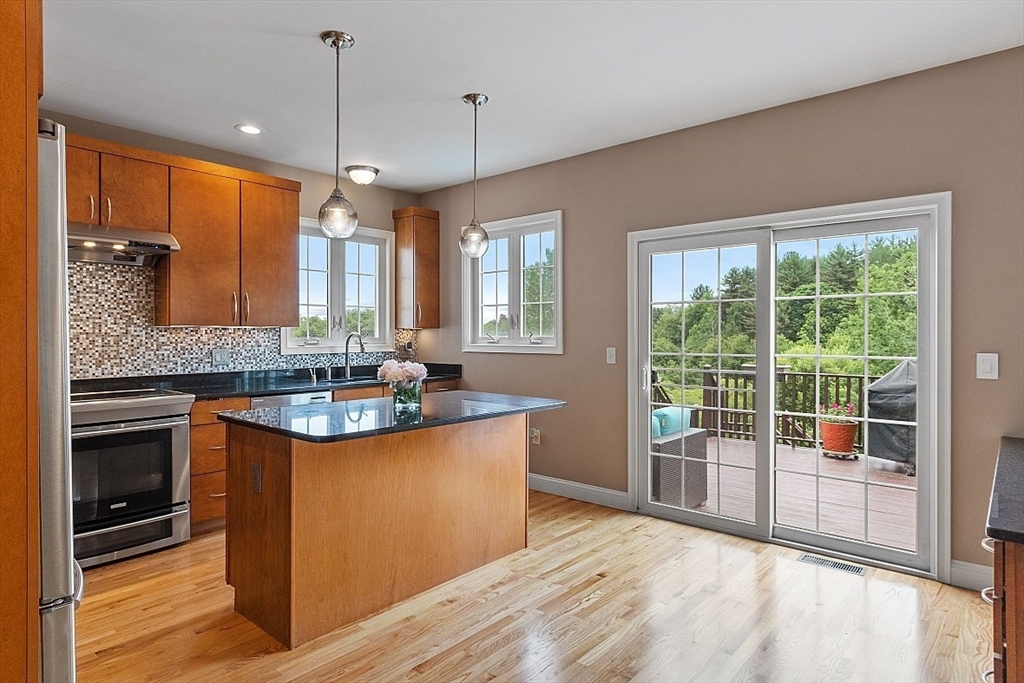 204 Littleton County Road Harvard, MA 01451 - Photo 7 of 42 a kitchen with stainless steel appliances granite countertop a sink stove and refrigerator