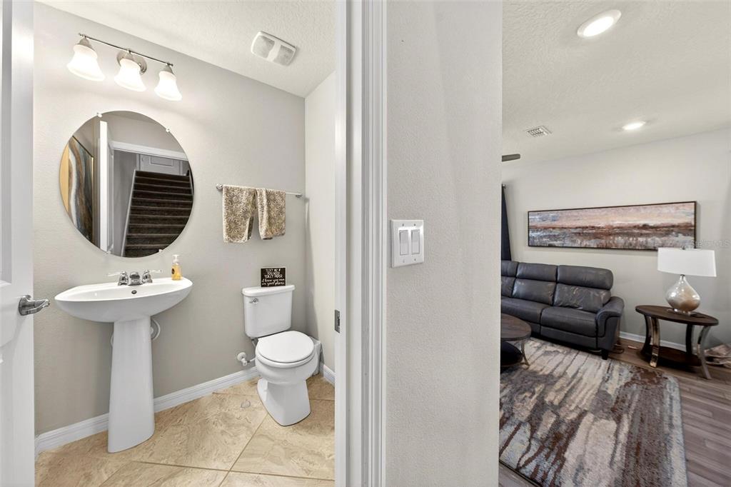 2100 Gopher Tortoise Terrace Oakland, FL 34787 - Photo 18 of 58 a bathroom with a toilet sink and mirror