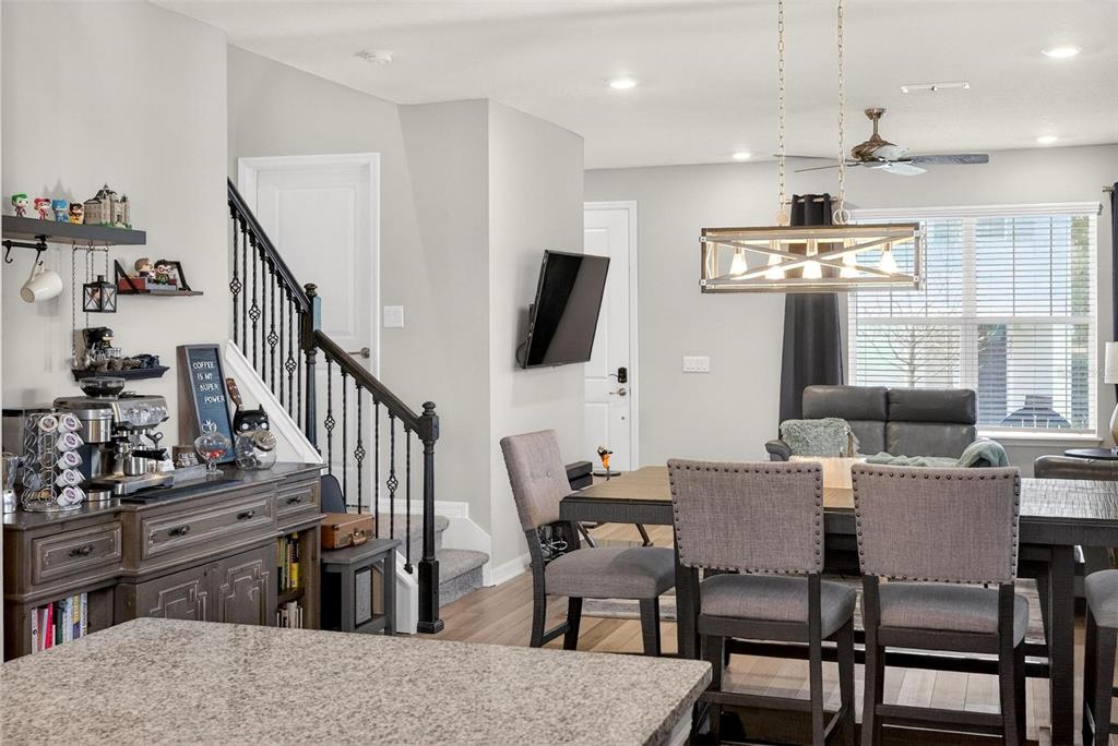 2100 Gopher Tortoise Terrace Oakland, FL 34787 - Photo 22 of 58 a view of a dining room with furniture