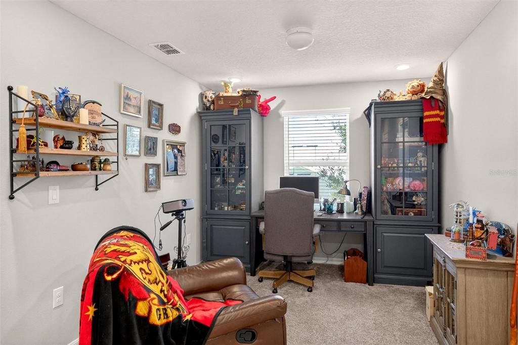 2100 Gopher Tortoise Terrace Oakland, FL 34787 - Photo 26 of 58 a view of a workspace with furniture and toys
