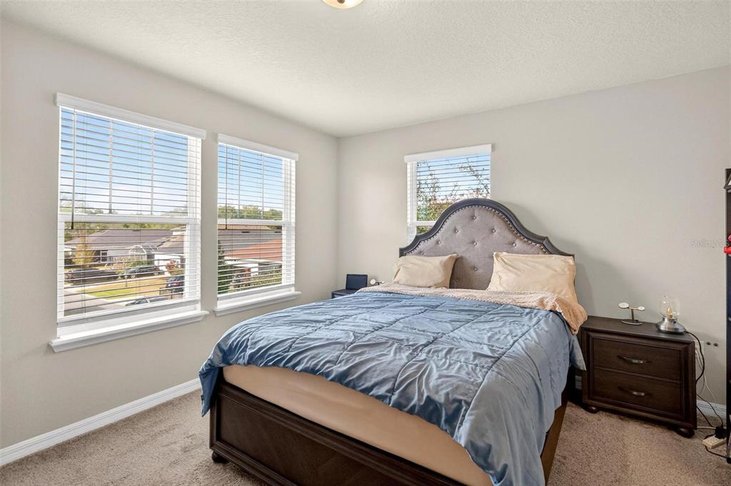 2100 Gopher Tortoise Terrace Oakland, FL 34787 - Photo 28 of 58 a bedroom with a bed and a window