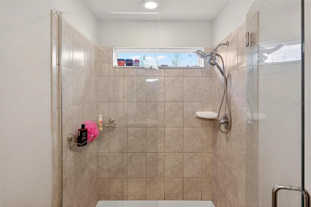 2100 Gopher Tortoise Terrace Oakland, FL 34787 - Photo 39 of 58 a bathroom with a shower