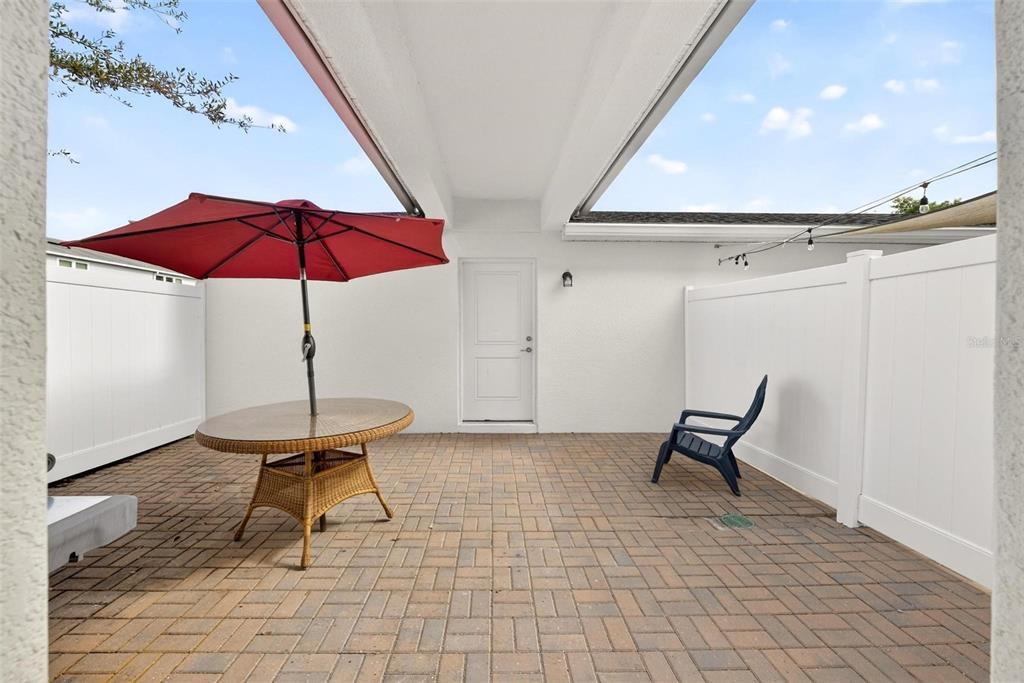 2100 Gopher Tortoise Terrace Oakland, FL 34787 - Photo 40 of 58 a view of a room with wooden floor table and chairs