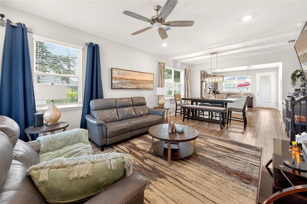 2100 Gopher Tortoise Terrace Oakland, FL 34787 - Photo 4 of 58 a living room with furniture a rug and a window