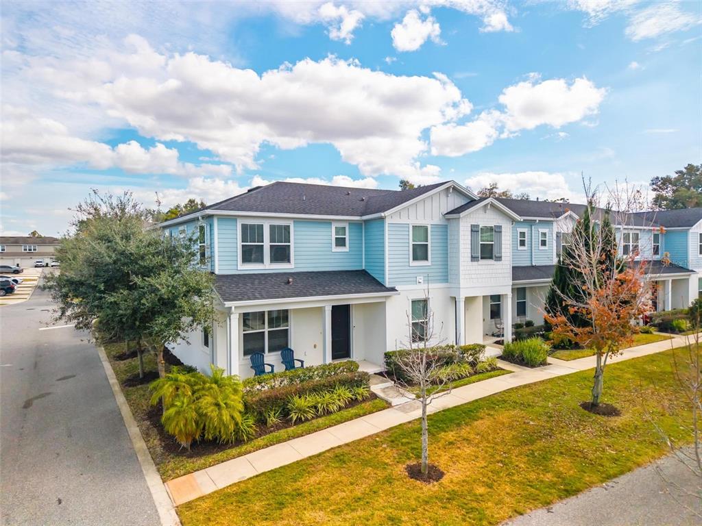 2100 Gopher Tortoise Terrace Oakland, FL 34787 - Photo 42 of 58 a front view of a house with swimming pool and furniture