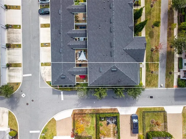 an aerial view of a house with a swimming pool