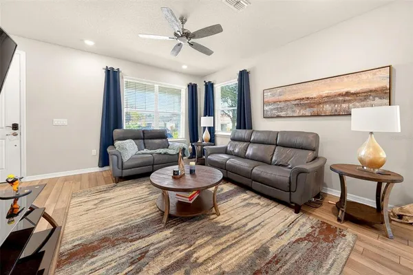 a living room with furniture and a large window