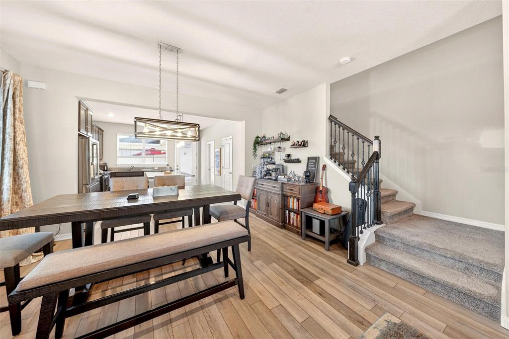 2100 Gopher Tortoise Terrace Oakland, FL 34787 - Photo 7 of 58 a living room with furniture and a wooden floor