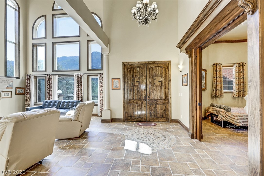 264 Crestview Drive Mount Charleston, NV 89124 - Photo 12 of 78 This living space features high ceilings, tile flooring, and abundant natural light.