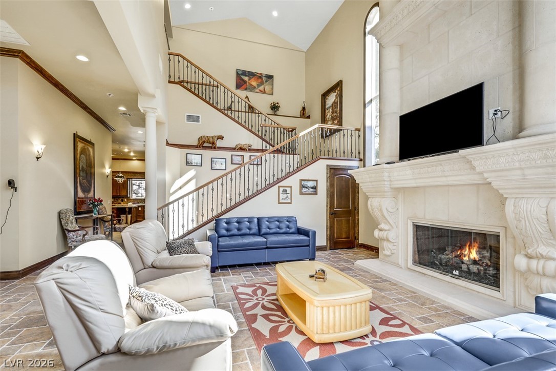 264 Crestview Drive Mount Charleston, NV 89124 - Photo 16 of 78 This grand living area features a majestic fireplace and a captivating staircase.