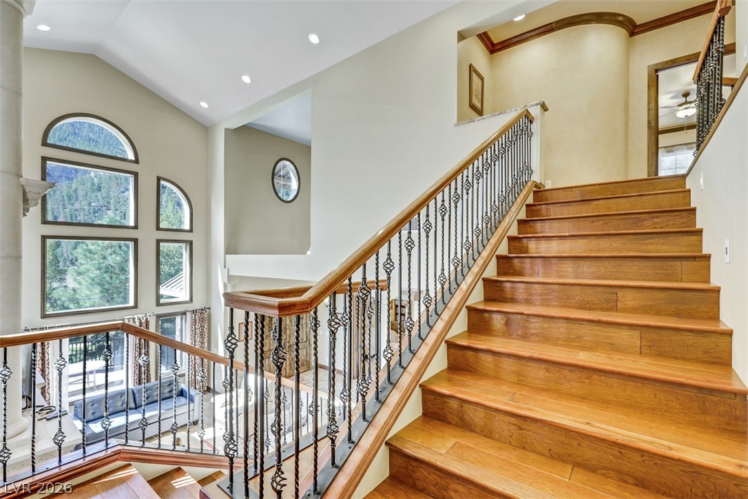 264 Crestview Drive Mount Charleston, NV 89124 - Photo 18 of 78 This spacious foyer features an elegant staircase and soaring ceilings, creating a grand entrance.