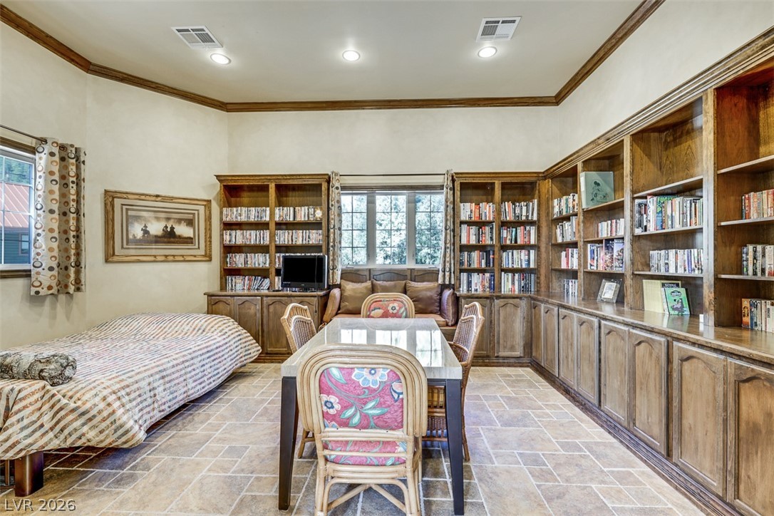 264 Crestview Drive Mount Charleston, NV 89124 - Photo 20 of 78 This versatile room features extensive built-in shelving, offering abundant storage and display space.