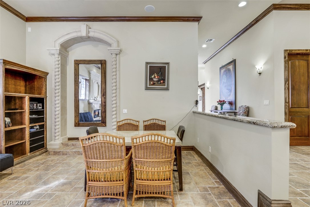 264 Crestview Drive Mount Charleston, NV 89124 - Photo 34 of 78 This inviting dining area features intricate architectural details and durable tile flooring.