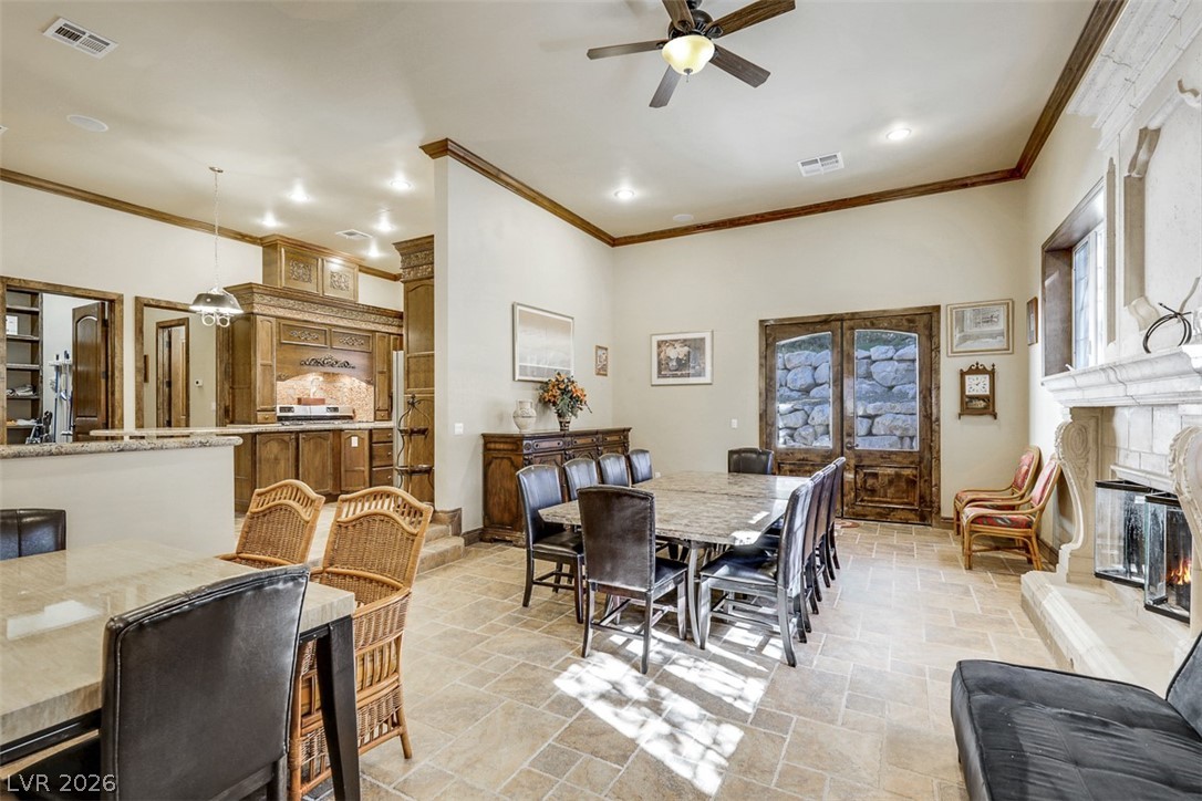 264 Crestview Drive Mount Charleston, NV 89124 - Photo 37 of 78 This grand dining area features ample seating and a stately fireplace, perfect for entertaining.