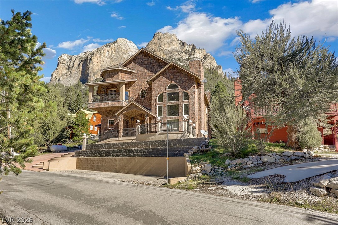 264 Crestview Drive Mount Charleston, NV 89124 - Photo 4 of 78 This majestic stone-clad residence offers dramatic mountain views, perfect for an elevated living experience.