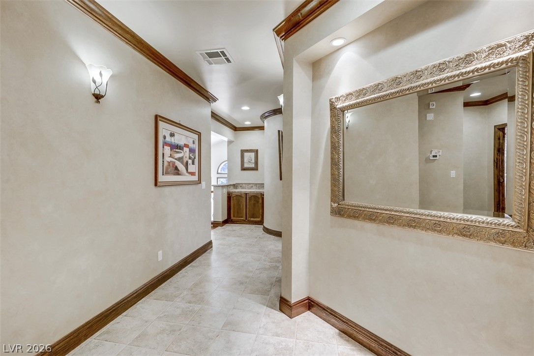 264 Crestview Drive Mount Charleston, NV 89124 - Photo 42 of 78 This spacious hallway features decorative trim and elegant tile flooring, perfect for welcoming guests.