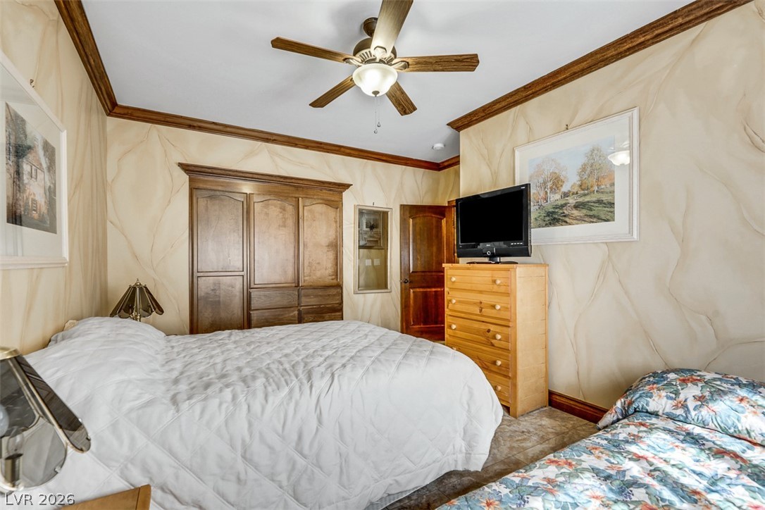 264 Crestview Drive Mount Charleston, NV 89124 - Photo 44 of 78 This cozy bedroom offers a tranquil retreat with warm tones and inviting textures.