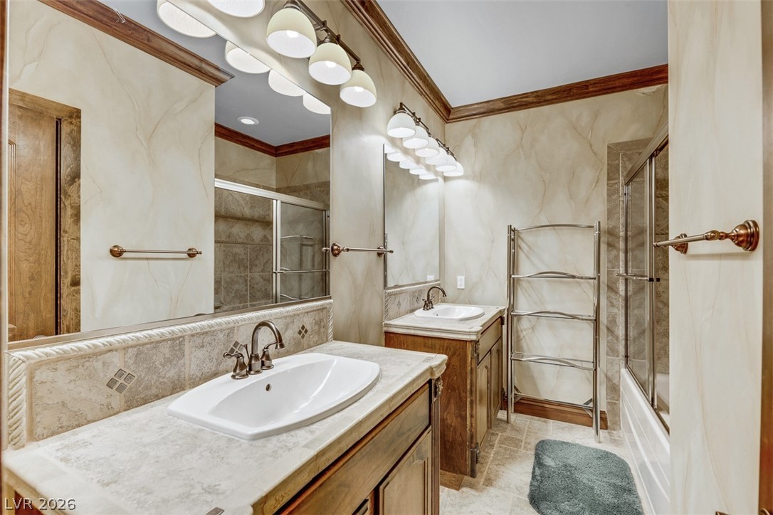 264 Crestview Drive Mount Charleston, NV 89124 - Photo 45 of 78 This bathroom features double vanities and a combination tub and shower with tile surround.