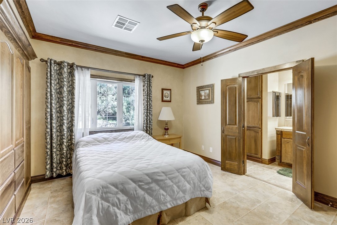 264 Crestview Drive Mount Charleston, NV 89124 - Photo 48 of 78 This bedroom offers spacious comfort with convenient access to an en-suite bathroom.