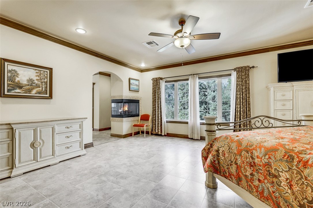 264 Crestview Drive Mount Charleston, NV 89124 - Photo 52 of 78 This spacious bedroom offers serene views, a cozy fireplace, and ample natural light.